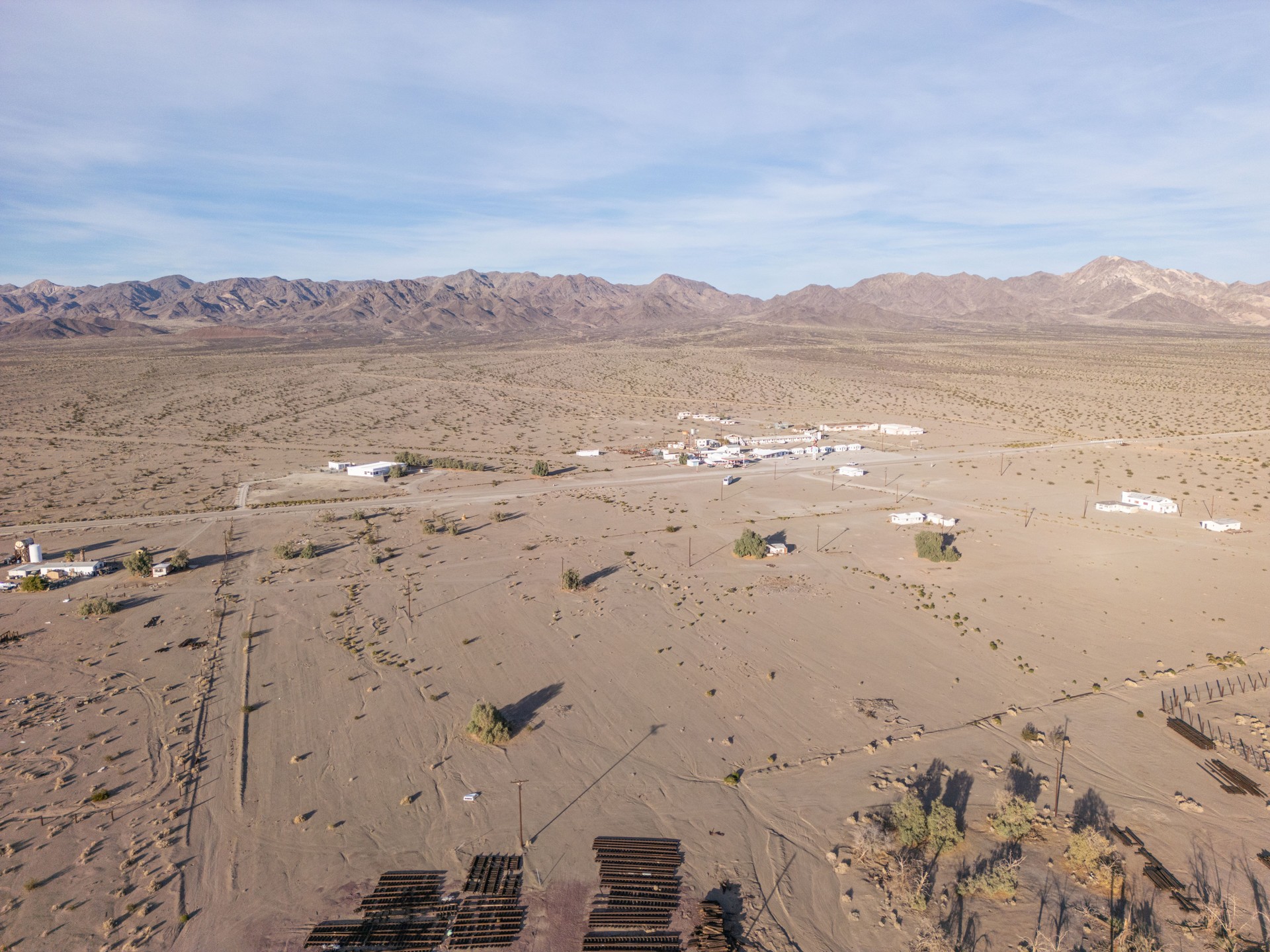 Aerial View of Desert Settlement and Mountain Range